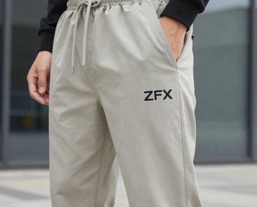 Close-up of skilled tailors sewing men's t-shirts in a bright, modern factory.