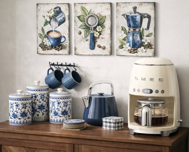 Retro cream Smeg coffee maker on a wooden sideboard with blue floral canisters and kitchen wall art.