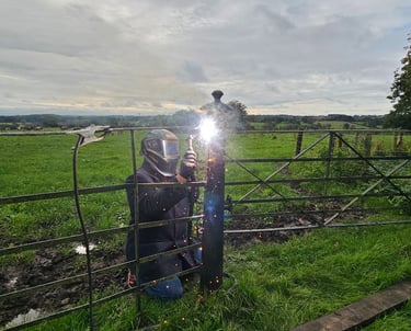 a person on site welding using a MIG welder