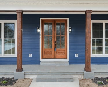 Striking modern entryway with clean lines, warm lighting, and bold design that leaves a lasting impr