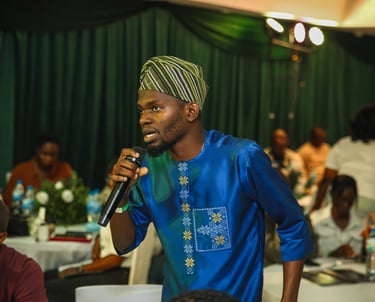 A participant asking a question to the panelists