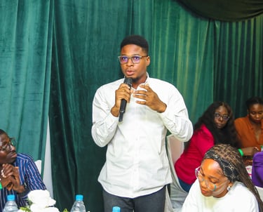A participant at the Beyond Farming Summit asking a question to the panelists