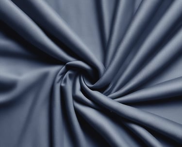 Brightly colored school uniform shirt neatly folded on a wooden table.