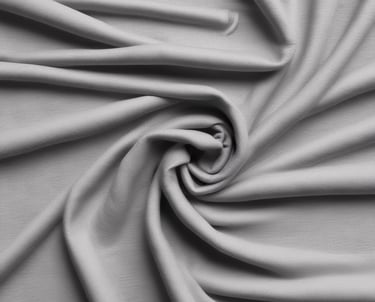 Close-up of soft, high-quality Pima cotton fabric in white.