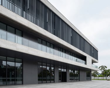Modern minimalist residential building with clean lines and natural light.