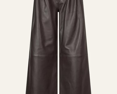 High-waisted dark brown faux leather wide-leg trousers with pleated front detailing.