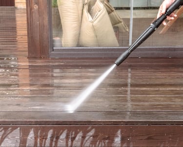 Pressure washing deck before exterior painting