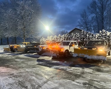 Picture of plow trucks after plowing a complex