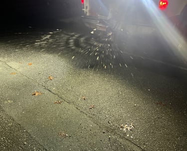 Truck salting a parkinglot.