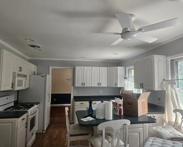 a kitchen with a ceiling fan and a ceiling fan