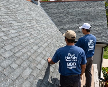 A skilled handyman repairing a roof shingle on a sunny day.