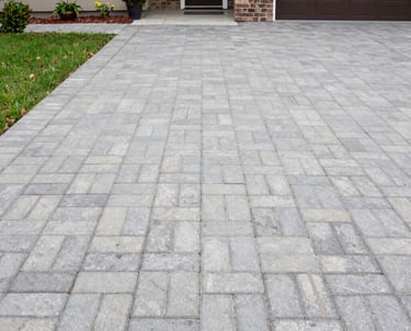 A freshly cleaned house exterior with sparkling windows and clear gutters under bright sunlight.