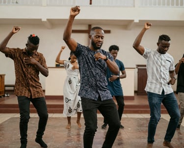 A diverse group of people watching a heartfelt church service video together.