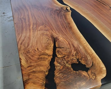 Black walnut boardroom table — natural wood grain detail