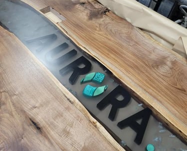12ft x 5ft black walnut epoxy river table — production angle