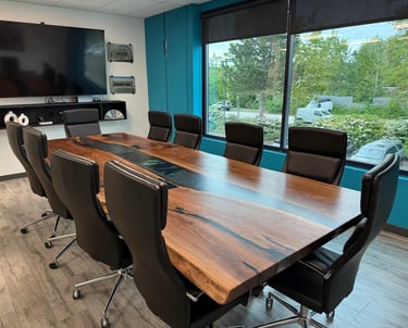 12ft x 5ft black walnut epoxy river boardroom table installed — Aurora Glass