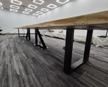 Custom maple boardroom table — steel base detail and surface edge view