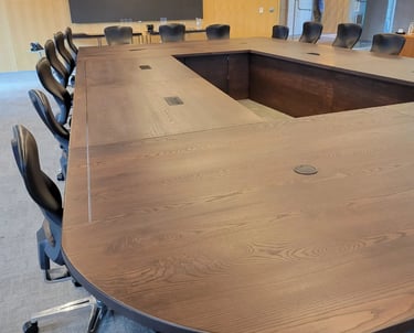 Custom white ash conference table — satin hardwax oil finish and grain surface detail