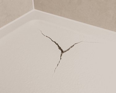 Close‑up of a cracked shower tray surface – detail of a damaged tray in an Auckland bathroom