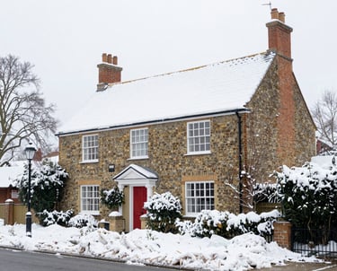 a man riding a skateboard down a street next to tall buildings