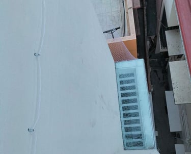 duct area covered with a tightly secured pigeon safety net in an apartment complex.