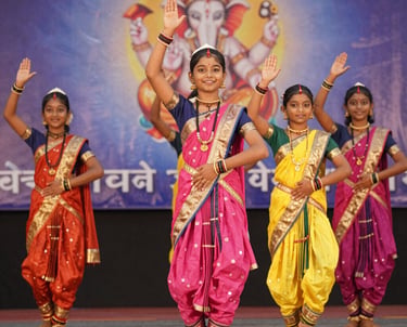 A lively group of dancers mid-performance, showcasing energy and joy in a colorful studio setting.