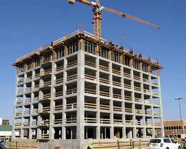 Construction crew working on the steel framework of a government building.