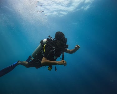 Andaman trip details - A soulful underwater view of a scuba diver exploring the deep blue silence of
