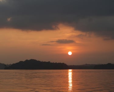 Andaman trip details - A soulful sunset view over the quiet coastal silhouette and shimmering waters