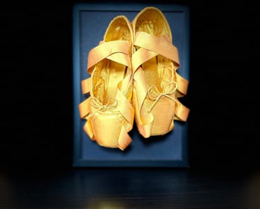 Handcrafted framed pointe shoe artwork with gold ballet shoes
