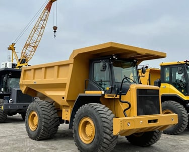 A powerful loader lifting heavy materials at a busy construction site in Jinan.