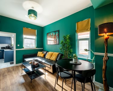 Modern Nottingham apartment living room with Smart TV, sofa and dining area