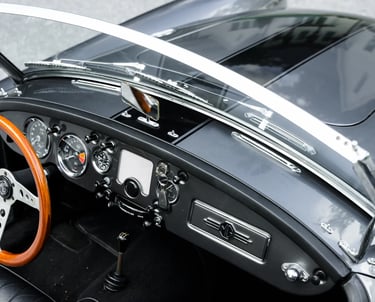 A close up view of the driver controls for a 1958 MG MGA Roadster.