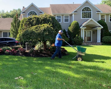 On Point Everything Inc lawn care truck and crew providing professional service in Port Jefferson St
