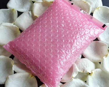 white plastic pack on purple and white floral textile