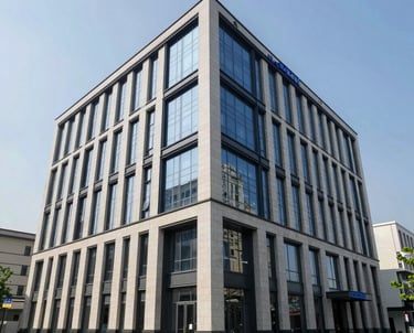 A professional wide-angle photo of a newly finished commercial building with a stunning glass and stone facade, designed by BlueCrest. Global Professional / International.
