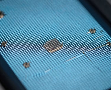 Macro shot of a high-resolution display showing pixels and soft light blue light. Symbolic of detail and engineering precision.