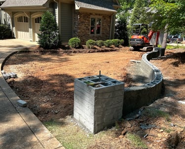 During motor court project. Block masonry. Grading.