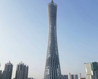 Engineers reviewing blueprints of a high-rise tower’s steel framework on site.