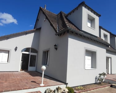a house with a brick wall and a brick wall