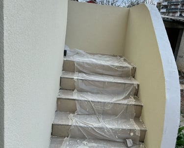 a staircase casement with a white wall and stairs