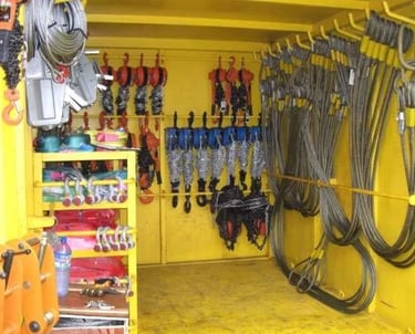 container with sling, hoists, wire rope, shackles ready for rigging inspection