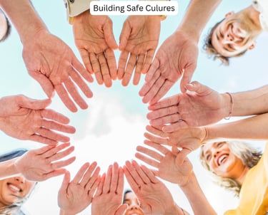 Youth celebrating with all hands together in a circle