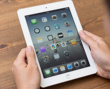 A professional inspector examining a property's interior with a clipboard and camera.