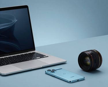 A minimalist workspace featuring a high-end laptop and a Google Pixel phone. Soft Silver Lake Blue and Oxford Blue lighting. Modern professional vibes.