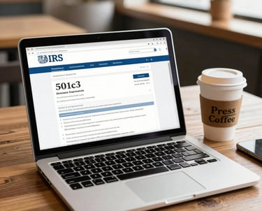 A warm, inviting workspace with a laptop, notebook, and coffee cup symbolizing focused nonprofit consulting.