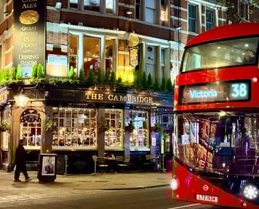 London double-decker bus in front of The Cambridge Pub in Theater District