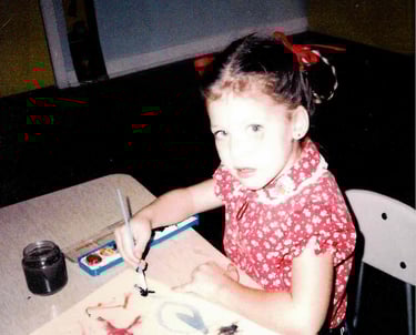 Young Paige Harlow painting