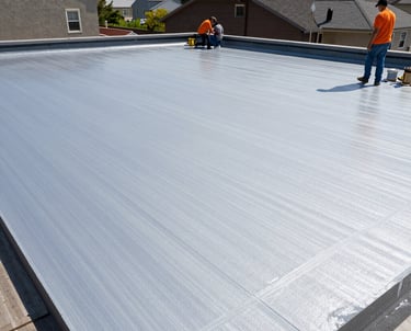 A close-up of a freshly coated flat roof glistening under sunlight.