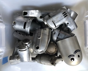 Metal parts in a sculptor's workshop bin, image 9.